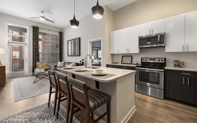 a kitchen with a dining table and chairs